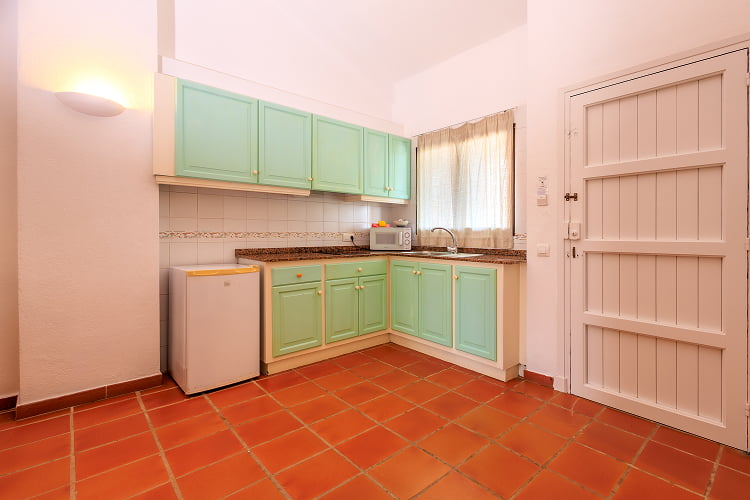 Apartment - Kitchen Spacious kitchen in sea water colour with dining table and TV
