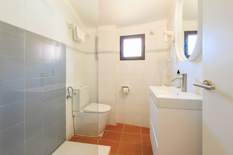 Duplex - Bathroom side view Bathroom with shower tray and hairdryer